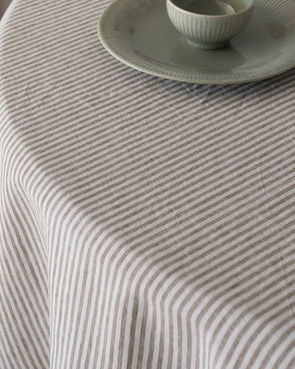 olive strip linen tablecloth natural earthy tone dining setup