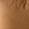 Brown pillow on a chair with a neutral background