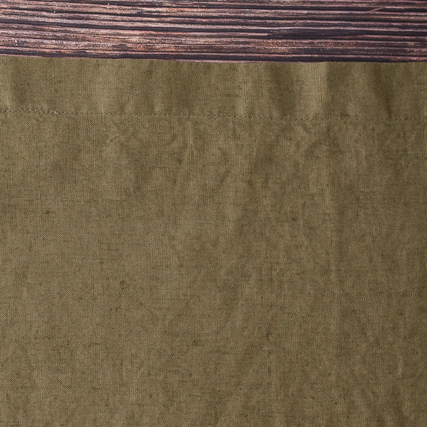 Close-up of Olive 100% Linen Placemat with a wooden surface above