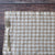 Nature Gingham placemat with a fork on a wooden surface