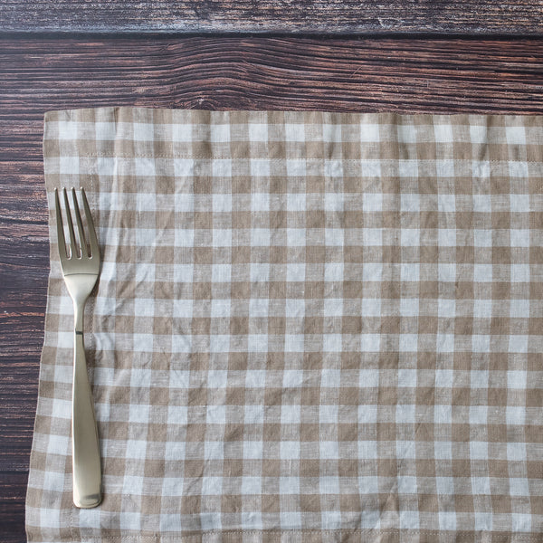 Nature Gingham placemat with a fork on a wooden surface