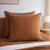 Tobacco brown European linen pillowcases on a bed in a bedroom setting