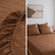Tobacco brown linen fitted sheet on a bed with a close-up detail, and a bedroom setting with the bedspread.